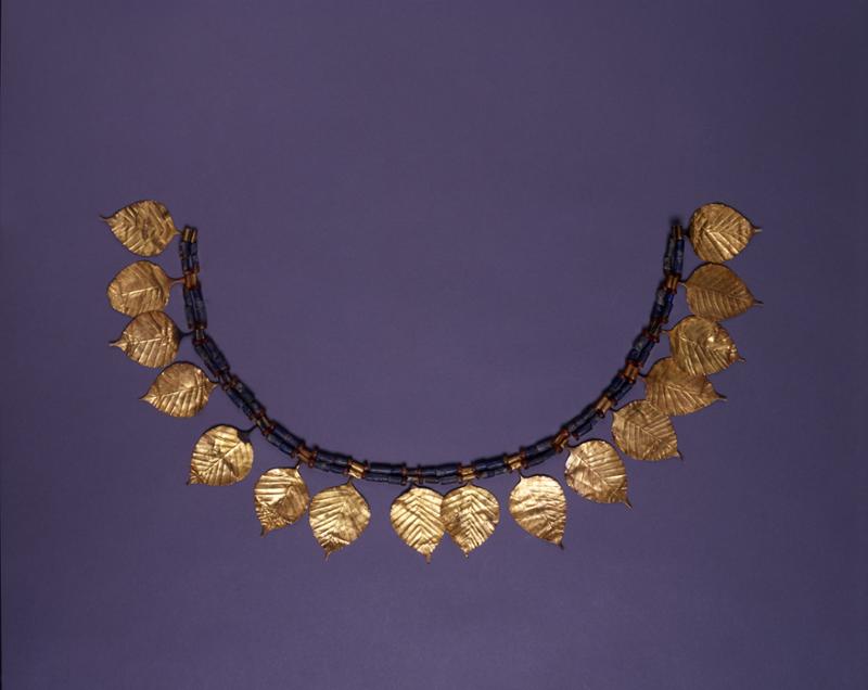 Gold beech-leaves with lapis tubular and carnelian beads-two separate groups strung together to form a necklace.