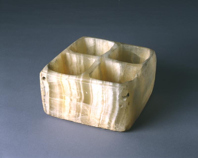 Alabaster box with four square compartments.