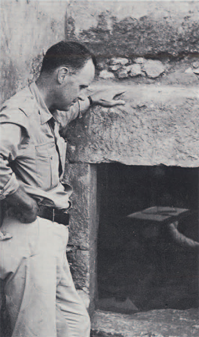 photo of man standing by well