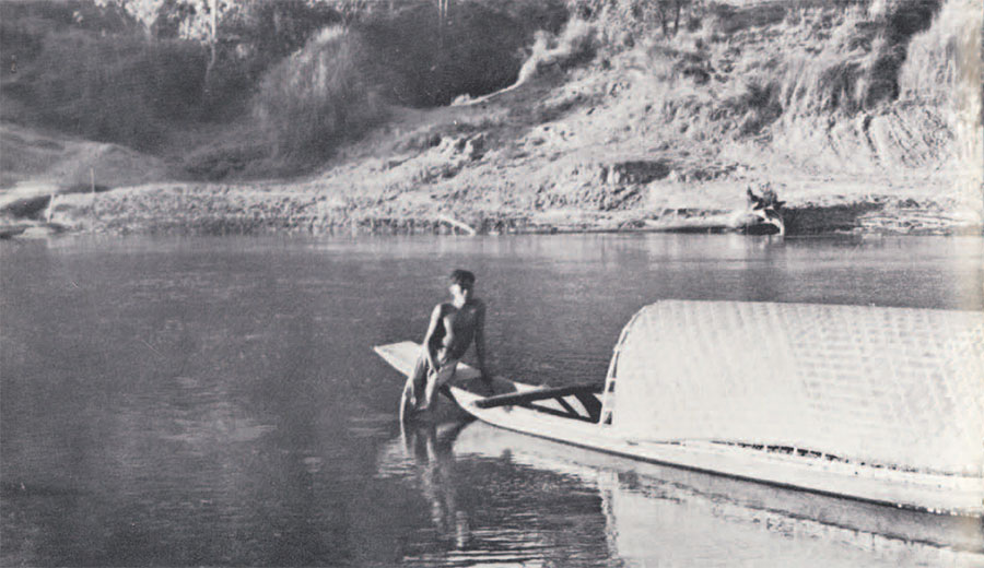 Photo of boy sitting on boat