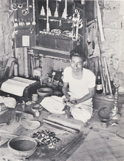 photo of man making jewelry