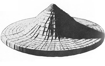 Conical crown with braided rattan forming peak.