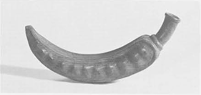 Pottery whistle modeled in the shape of a pod of the pacay tree (Inga pacay). This is from the Mochica culture of the North Coast of Peru, dating from about A.D. 200. Length 9 &frac12; inches.