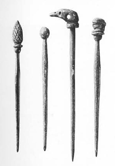 Ornamental ivory hairpins typical of those used by Roman women of the Imperial period.