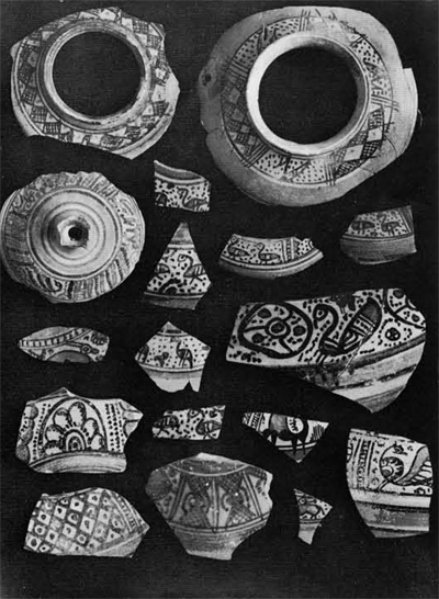 Fragments of Islamic pottery showing a vareity of decorative motifs.