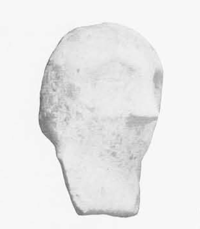 Crudely shaped terracotta in the form of a head with a beard.