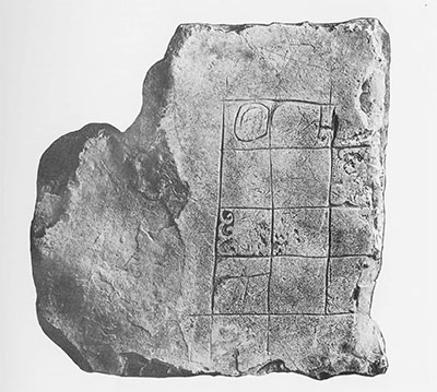 Fig. 6. Miscellaneous Sculptured Stone 3, Piedras Negras. Used as top stone, carved side up, in secondary masonry step-platform of palace Structure J-12, Acropolis Court 2. Note incised grid, incomplete carvings in non-contiguous squares. Excavated 1931. Maxium dimensions of sculptured surface, 45 x 46 cm. (ca. 18x 18 inches); stone is 7 cm. thick (ca. 3 inches). 