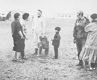 Froelich Rainey revisits Point Hope, Alaska after an absence of twenty-five years. The Eskimo couple on the right were 'teen-age friends who worked in the excavation at Ipiutak in 1940.