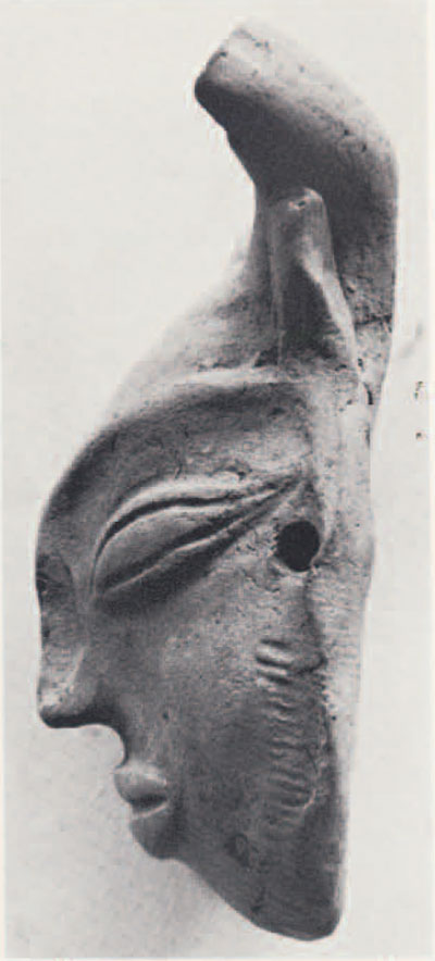 A miniature terracotta mask from Mohenjo-daro. The combining of animal ears and horns with a human face suggest some religious or mythological significance unknown to us today.
