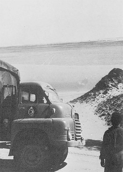 One of the Desert Police Department's Bedford trucks carrying water and gasoline for the expedition, southeast Libyan desert.