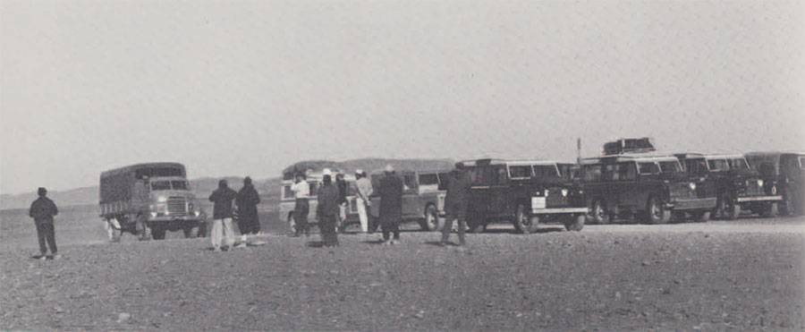 Our caravan of eight Land Rovers and two Bedford trucks leaving Sebha in the Fezzan en route to the Tibesti Mountains. 