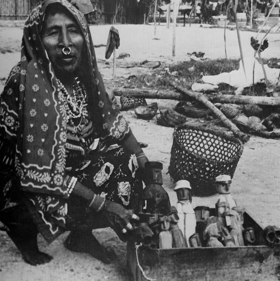 Medicine woman with her supply of the powerful uchus, whose spirits go down into the nether world to search for the health of her sick patient. 