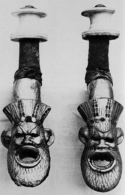 Harness saddles from one of Tutankhamun's state chariots had gold-covered heads of the god Bes on the outer leg. The whole was held together by the alabaster boss at top, the girth straps passing through the mouth of Bes. 