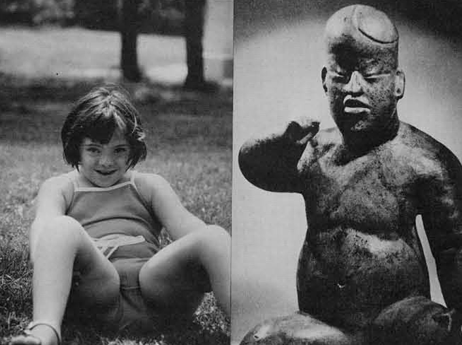 A girl with Down's Syndrome and a figurine of a child.