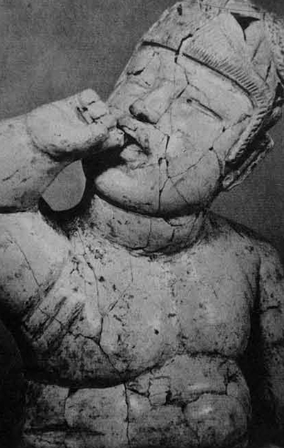 An Olmec figurine of a child.