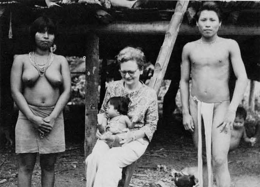 Child mortality is high, so most families are small. Here the author is shown with two of these families.