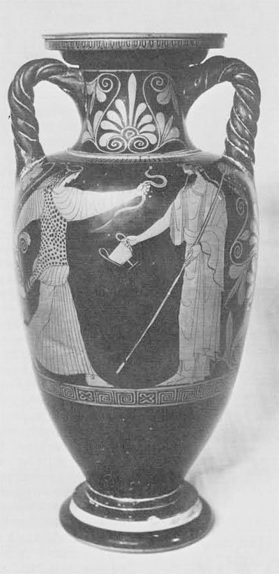 Amphora depicting Dionysos and a maenad. Maenad at left, Dionysos at right. Maenad wears leopard's skin, holds oinochoe in right hand and a snake in the other. Dionysos faces her, standing, thyrsus in left hand and kantharos in right.