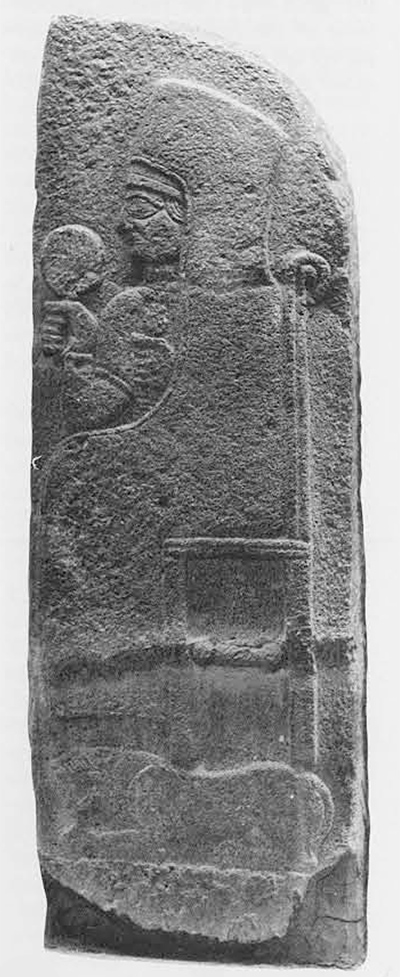 Relief of a goddess seated, a lion at her feet.
