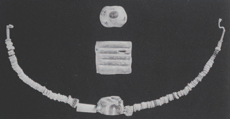 Representative examples of beads from the hoar under the Beth Shan temple stairway. Small silicate artifacts were locally manufactured at Beth Shan, and show a coalescence of Egyptian and Canaanite styles and technologies ( see also Fig. 1). In the middle of the string of beads (mostly discs, cylinders, and fluted varieties of standard Egyptian faience) is a large barrell-shaped bead with a feather of ogee pattern of calcium antimonate white glass overlaid on a base glass uniquely colored with fine silver particles in a colloidal suspension. Above a multi-tubular bead spacer, used to separate strands of beads and pendants on large necklaces or pectorals, is an eye bead, which was made by impressing manganese-iron brown and calcium antimonate white crumbs one on top of the other into a cupric blue-green glass surface. Museum Object Numbers: 29-104-503, 29-104-359, 29-104-359