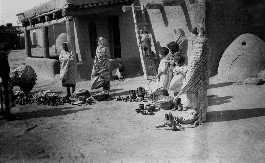 Pottery vendors at Santa Clara Pueblo, ca. 1935.  Courtesy Museum of New Mexico, neg. no. 4145. Photo by T. Harmon Parkhurst.
