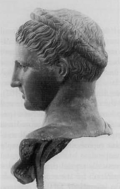 Bronze head from Herculaneum, Villa of the papyri, left profile. The bust is a modern restoration. Called variously Sappho, Berenike (a Ptolemaic Queen,) and Artemis, the head cannot be securely identified. Note that the strands of hair over the forehead are not twisted into separate bundles, but the strands pulled up from the temple to overlap the braid recall Hope Head.National Museum, Naples, no. 5592