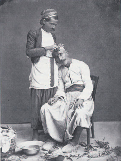 "Barbier rasant son client" (Barber shaving customer). Albumen orint by Bonfils, before 1885