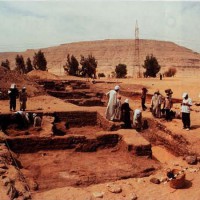 Excavations in progress in the mayor's residence, summer 1999 - view looking west towards the desert cliffs of southern Abydos