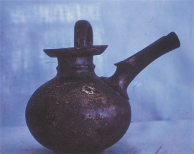 Fig 6. Jug with long, sieved spout. Such jugs were ideal for filtering out any debris from the fermentation process, and with the handle set at right-angle to the spout, drinking was expedited. 