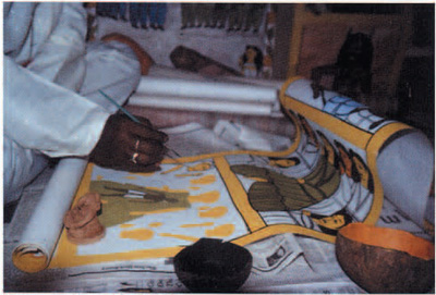 A person painting a hand scroll.