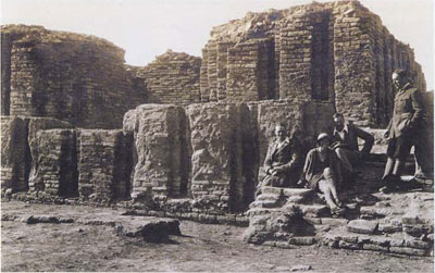 Members of the third season's expedition, 1924-25. Left to right: probably J. Linnell, Katherine Keeling (later Woolley), C. Leonard Wooley, and Father Leon Legrain, the expedition epigrapher and curator and curator of the Babylonian section at the University of Pennsylvania Museum.