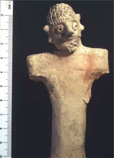 Figurines found in 1991 excavations: one shows the upper torso of a female and the other the complete body of a male