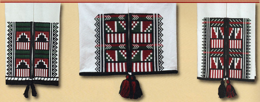 These Towa dance kilts, or kei-té, were made by Isabel Gonzales. According to her, Pueblo people “wear traditional attire when we have traditional dances. We pray for good rain, for harvest, and for a good life and to give us good blessings in our homes, for health and for strength and guidance in our lives. Dance kilts are used for many different purposes. They are worn by men in corn dances and by ladies when they do the buffalo dance. Usually the designs interpret the rain, clouds, and in the left example, mountains. In my work I try to interpret the best way I can with our traditional life . . . . This middle kilt is similar to the first one, but the designs are a little bit different. The arrows are pointing to the center as the drum group meets at the center of the plaza. The step designs are like the dance headdresses, or tablitas, that the women wear. Tablitas are a prayer for rain, and I consider these here as prayers for rain as well.” Isabel’s embroidery includes a number of meaningful details. For example, close examination of the last kei-té (right) reveals that the top edge of the black embroidered zigzag mountain design is embroidered to suggest that it continues—her “ongoing prayer for continuation and continued abundance in this life.”