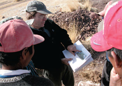 Erickson presents his book to Quechua farmers who participated in his experimental archaeology project in the 1980s. 