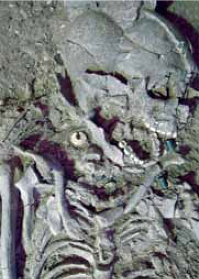 A human burial at the site included a white stone earring in the right ear and stone beads around the neck.