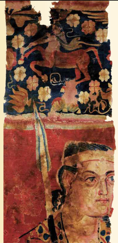 Tapestry fragment, a centaur amidst floral patterns above a warrior with a spear.
