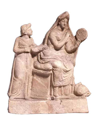 A Hellenistic terracotta of the late 4th century BC shows another woman looking into a mirror as she adjusts her dress with the help of an attendant. 