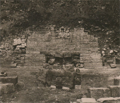 George B. Gordon excavated the Hieroglyphic Stairway on the Peabody Museum expedition to Copan, Honduras. Here are the lower steps of the Hieroglyphic Stairway the altar and the first seated figure as found, ca. 1900. Today the stairway rises 69 feet of about 21 meters.Penn Museum Image: 228288