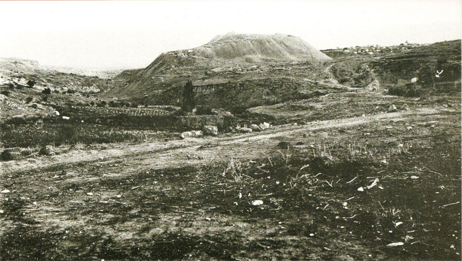 A photograph taken in the 1920s looks eastward, with the area of the Northern Cemetery to the left and the tell rising in the distance.