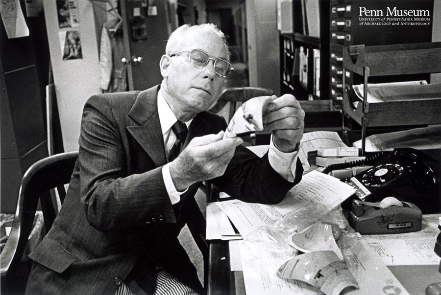John Cotter began teaching at Penn in 1960. His courses were the first offered in the field of historical archaeology. In this photo he examines pottery from an excavation.