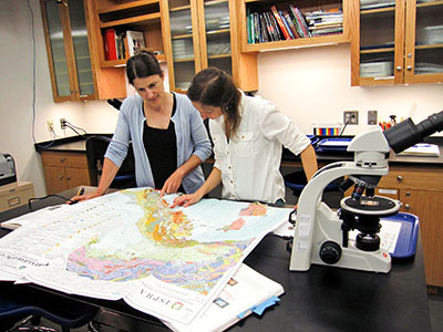 Since the provenance of a ceramic object is related to the geology of the area where it was made, Marie-Claude (left) and Sophie Crawford-Brown examine a geological map of Italy to see which rock types are located around Minturnae.