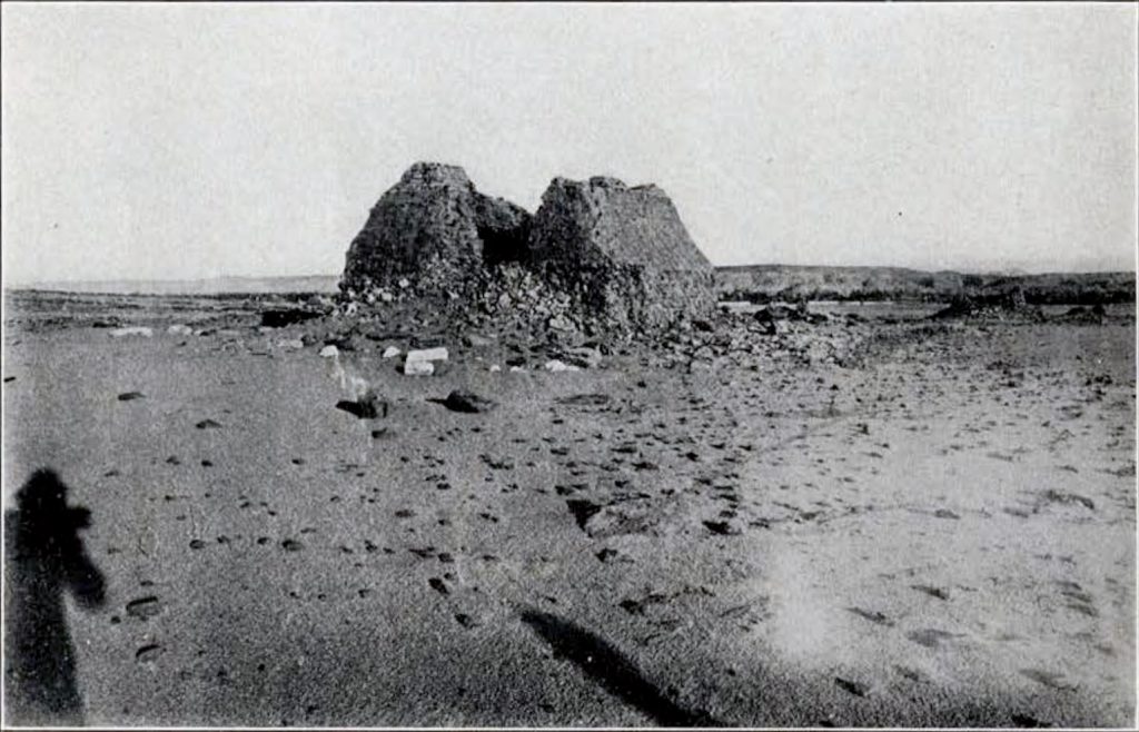 mud brick pyramidal tomb seen from afar