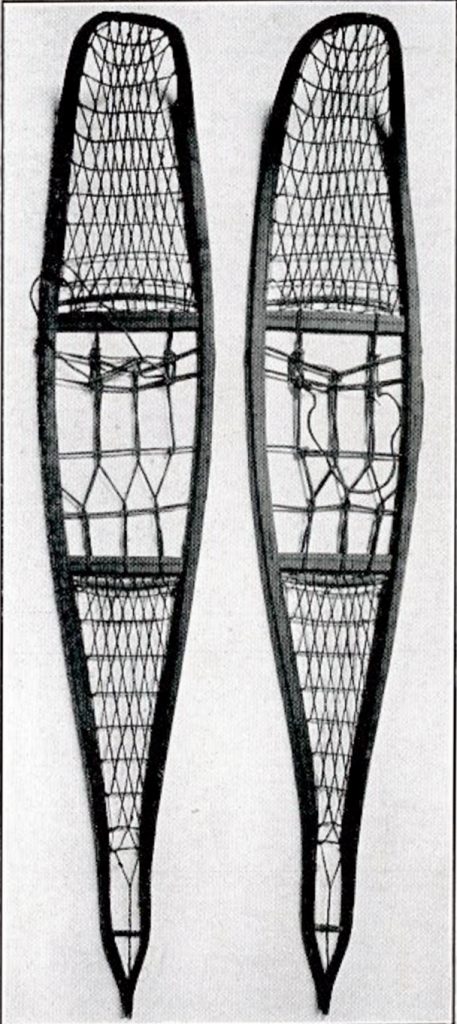 A pair of extremely long and narrow snowshoes