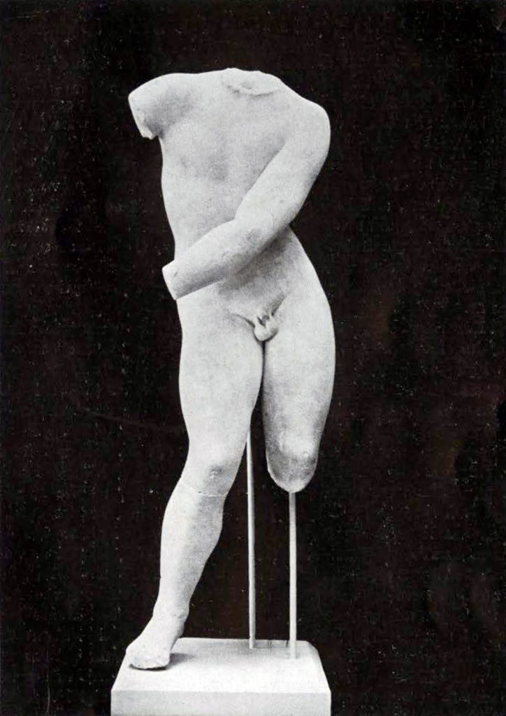 Nude sculpture of Eros stringing a bow, head, right arm, and left leg below the knee missing