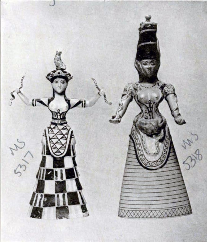 A statuette and votary of the snake goddess, one with arms raised in a checkerboard dress, the other with arms out in a striped dress