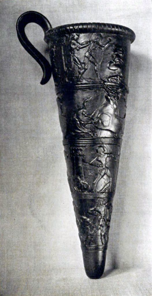 A rhyton with a pugilist and bull-grappling in relief in four bands