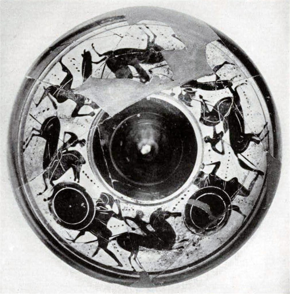 The lid of a bowl from above, showing a cavalrymen in combat with hoplite design