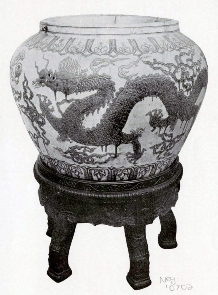 Large wide vase with an intricate dragon amongst the clouds on it