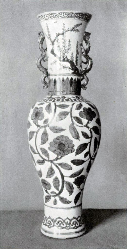 Tall, slender vase with floral pattern and two small dragon shaped handles