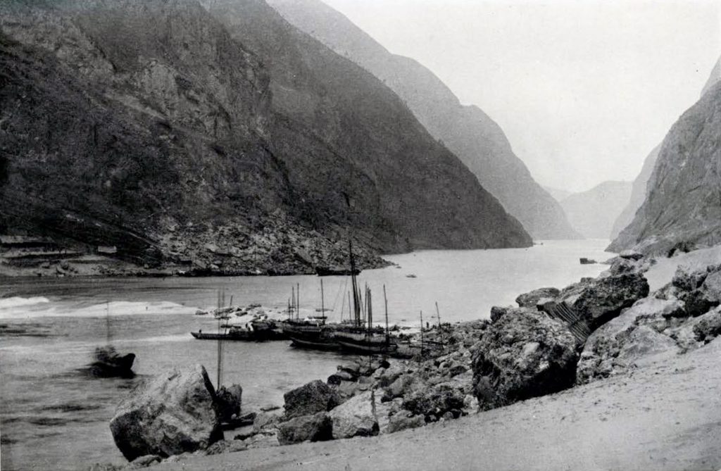 A group of boats at the edge of the rapids