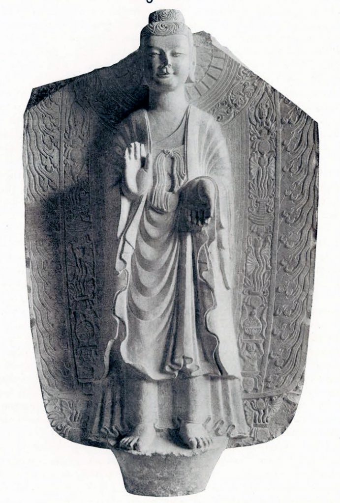 Grey limestone stela with high relief Sakyamuni Buddha against a mandorla